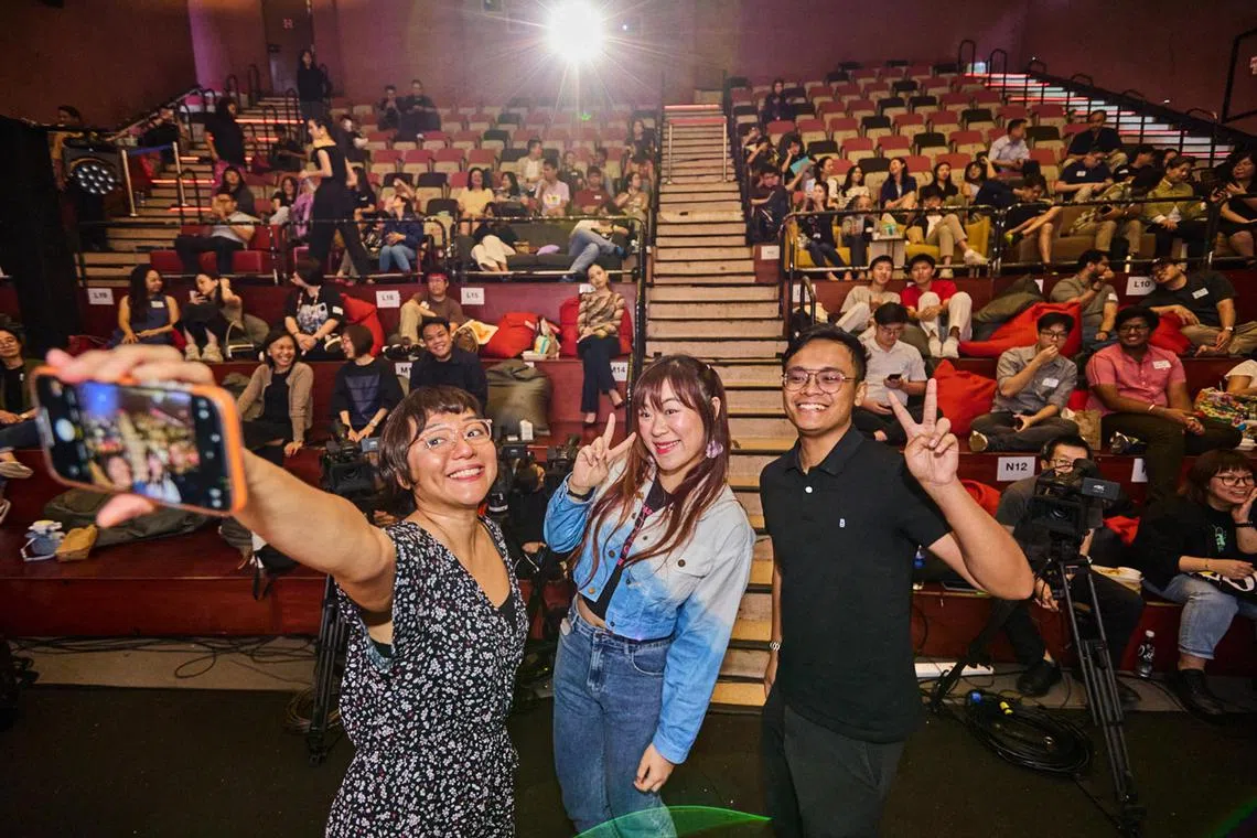 (From left) In Your Opinion host Lynda Hong with guest speakers Adella Yeo Rae-Nyse and Nabill Shukry Johari, as they take a wefie with the 100-strong audience at the Projector at Golden Mile Tower on April 15.