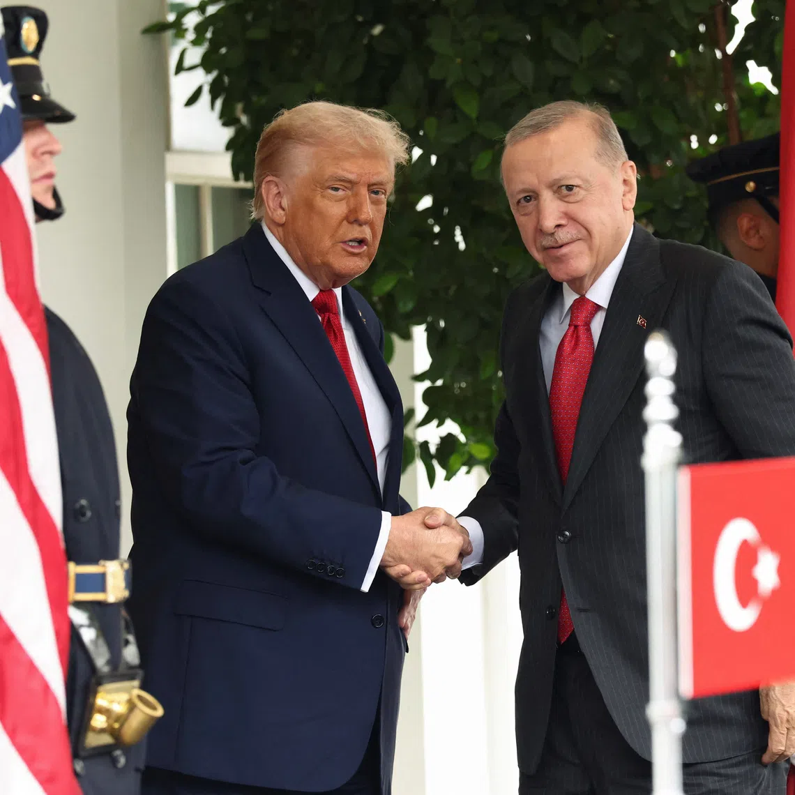 U.S. President Donald Trump and Turkey's President Recep Tayyip Erdogan shake hands as they meet at the White House in Washington, D.C., U.S., September 25, 2025. REUTERS/Kevin Lamarque