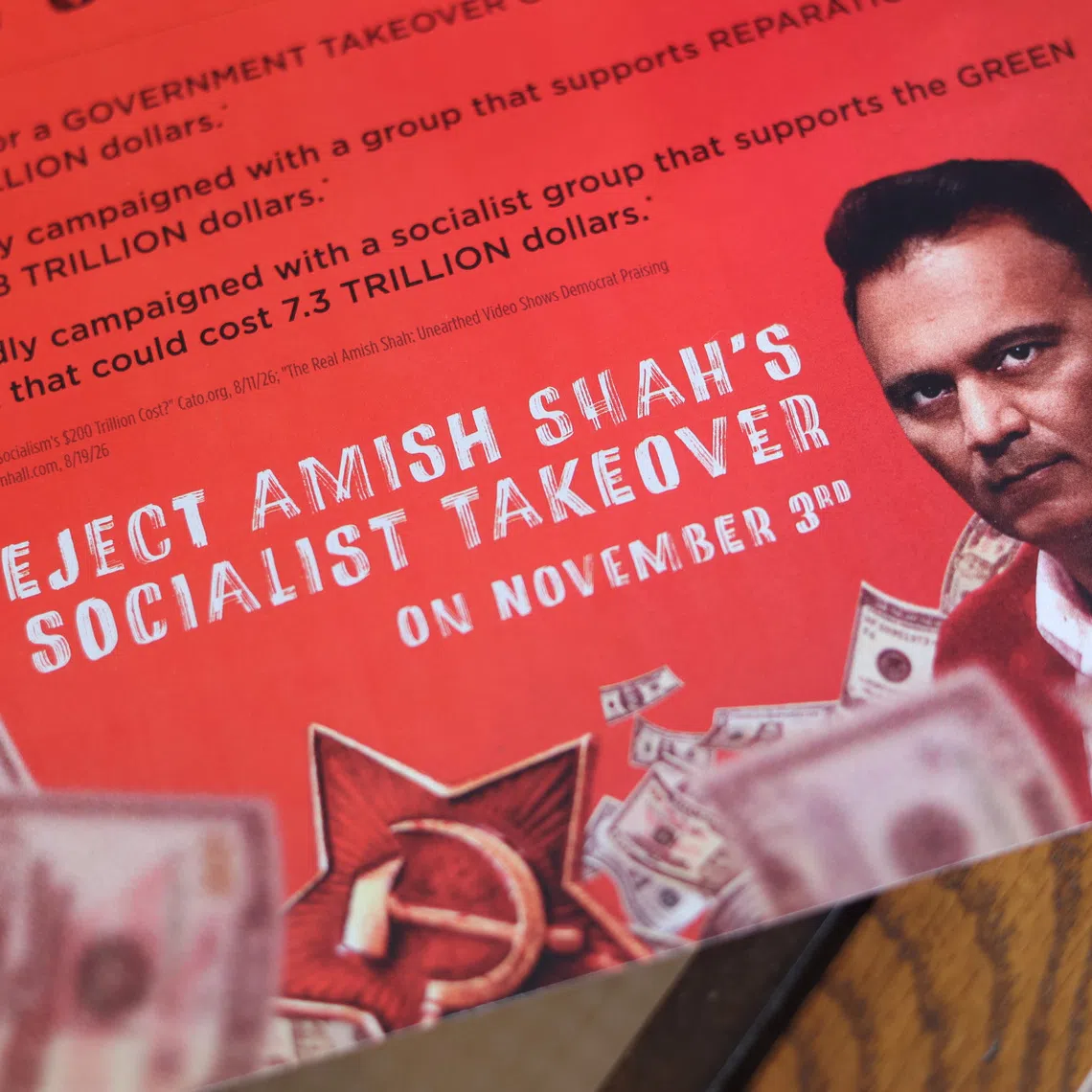 A flyer depicting congressional candidate Amish Shah as a socialist is displayed in Phoenix, Arizona, US, September 24, 2026.  REUTERS/Erica Stapleton/Illustration
