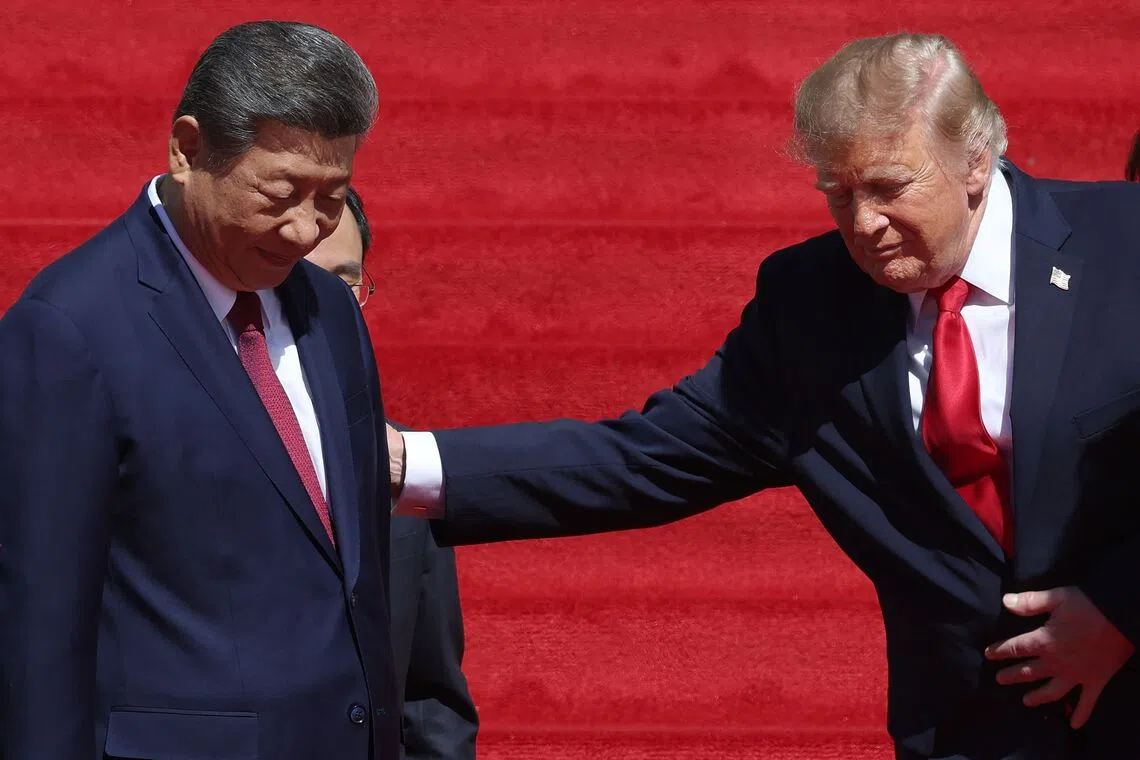 US President Donald Trump and Chinese President Xi Jinping leaving after a tour of the National Archives Museum on Sept 25 in Washington.