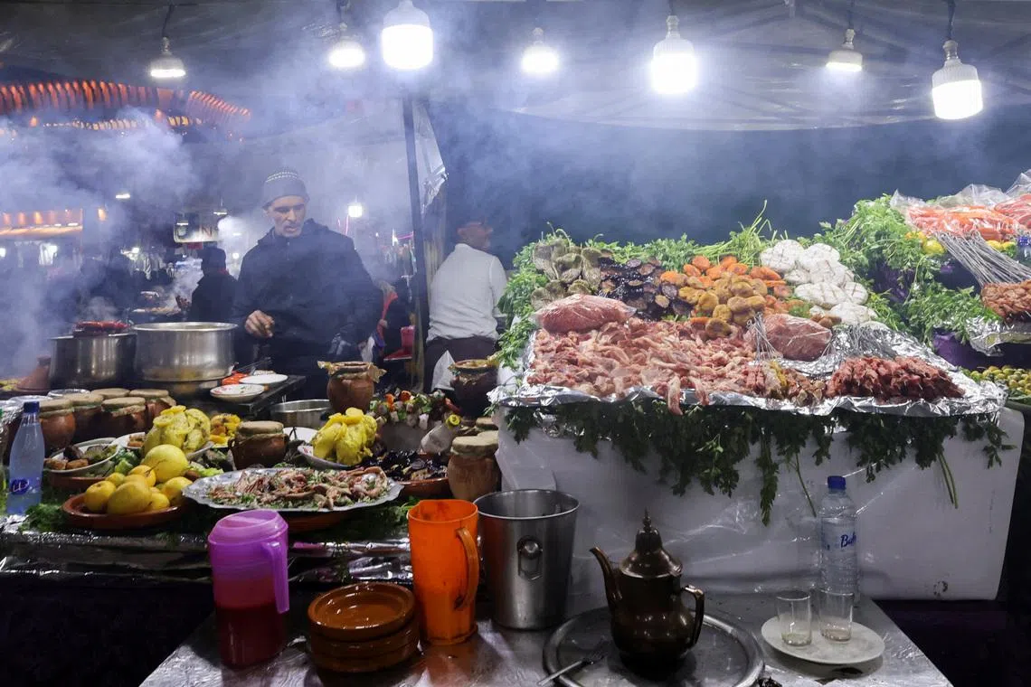 A Moroccan vendor selling a selection of grilled dishes in the main square of the Jemaa el-Fna Square, also known as the "Jamaa Lafna Square", which is listed as a UNESCO Cultural Heritage site, in the old city of Marrakech, Morocco, on Jan 11, 2026.
