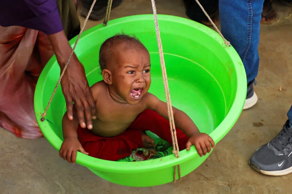 A Somali medical worker screens an internally displaced child for malnutrition at the Medecins Sans Frontieres (MSF) health centre at the Elbet 1 camp as humanitarian funding continues to decline despite rapidly increasing needs according to Medecins Sans Frontieres (MSF), in Baidoa, Somalia  August 10, 2026. REUTERS/Feisal Omar