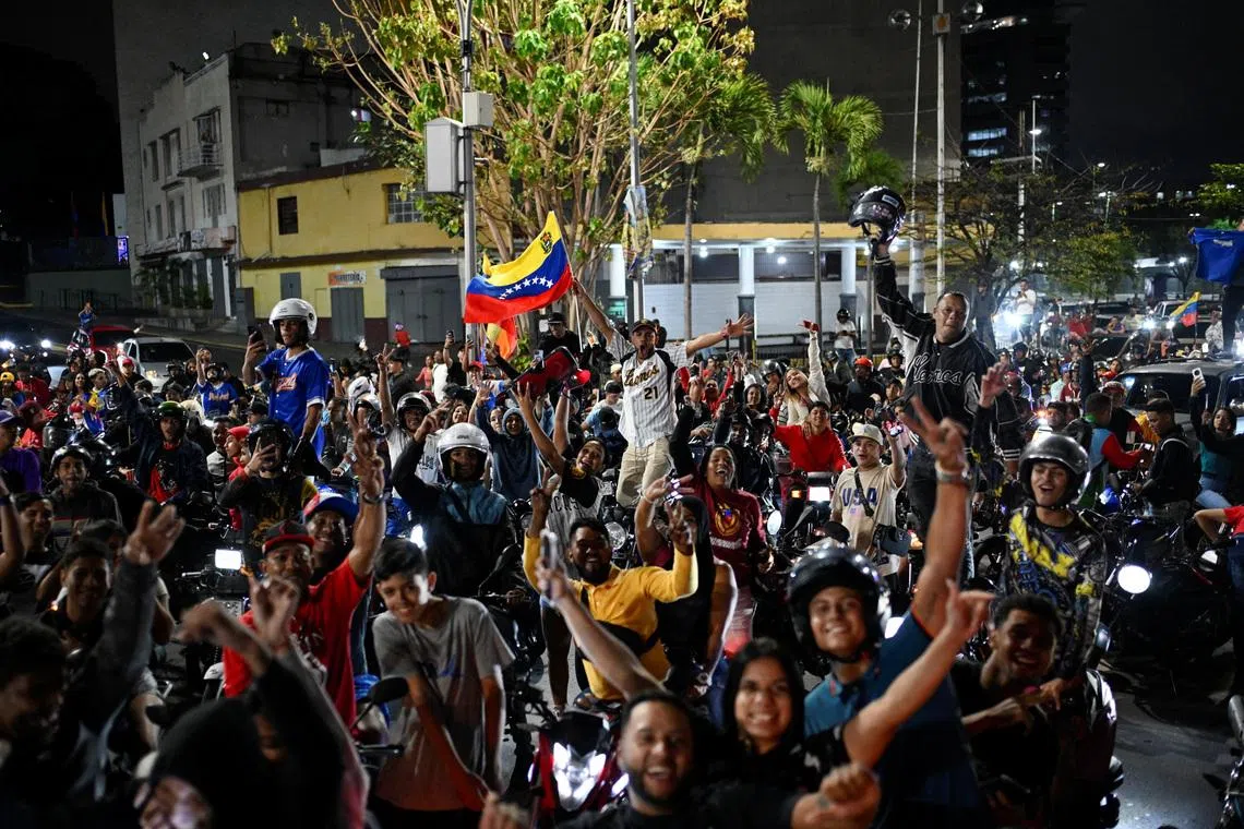 People celebrate Venezuela's victory over the U.S. in the World Baseball Classic final in Caracas, Venezuela, March 17, 2026. REUTERS/Maxwell Briceno