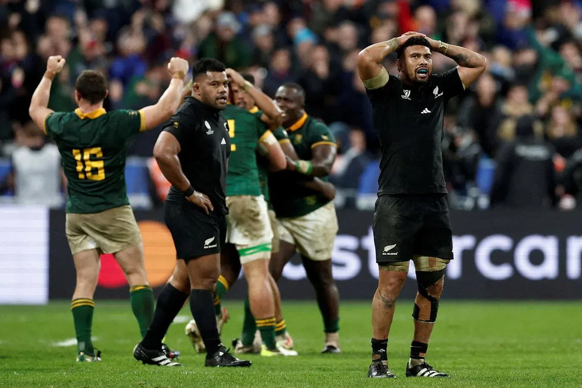 FILE PHOTO: Rugby Union - Rugby World Cup 2023 - Final - New Zealand v South Africa - Stade de France, Saint-Denis, France - October 28, 2023 New Zealand's Ardie Savea and Samisoni Taukei'aho look dejected as South Africa players celebrate after winning the world cup final REUTERS/Benoit Tessier/File Photo