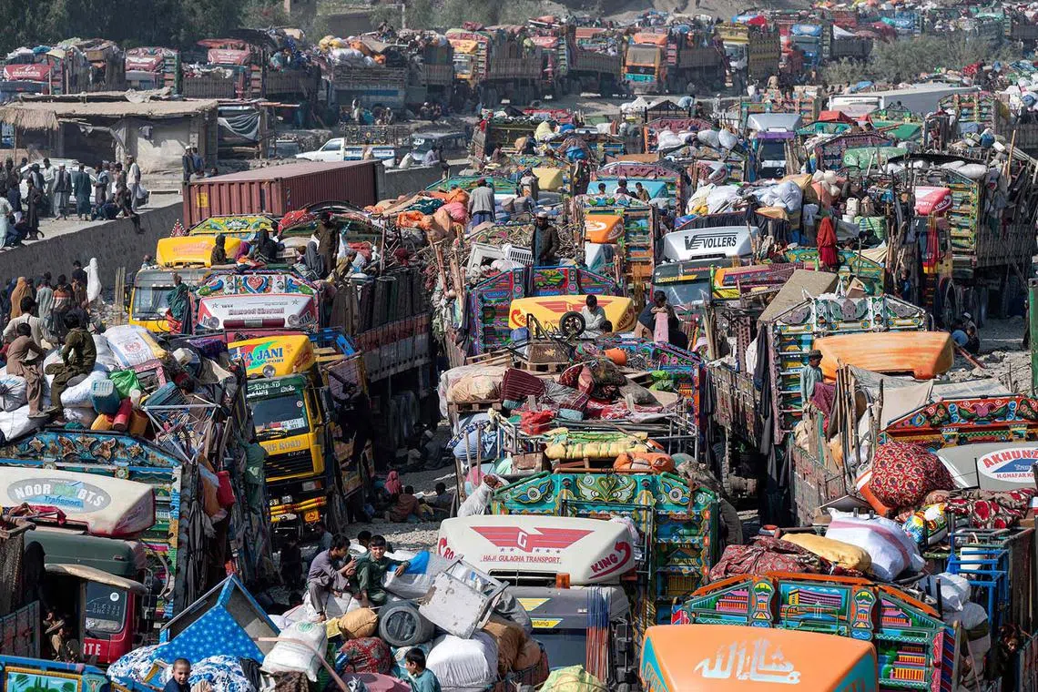 Afghan refugees arrive in trucks from Pakistan at the Afghanistan-Pakistan Torkham border in Nangarhar province on Oct 30. Islamabad has issued an order to 1.7 million Afghans it says are living in the country illegally to leave by Nov 1, or be deported. 