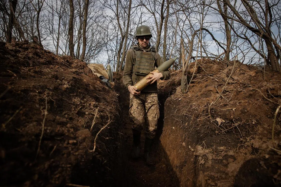 Ukrainian soldiers fire a howitzer towards Russians advancing on Avdiivka, Ukraine.