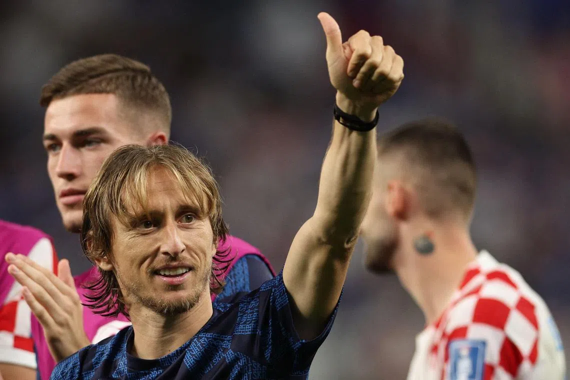A relieved Luka Modric greets Croatia's fans after their penalty shootout victory over Japan on Monday.  