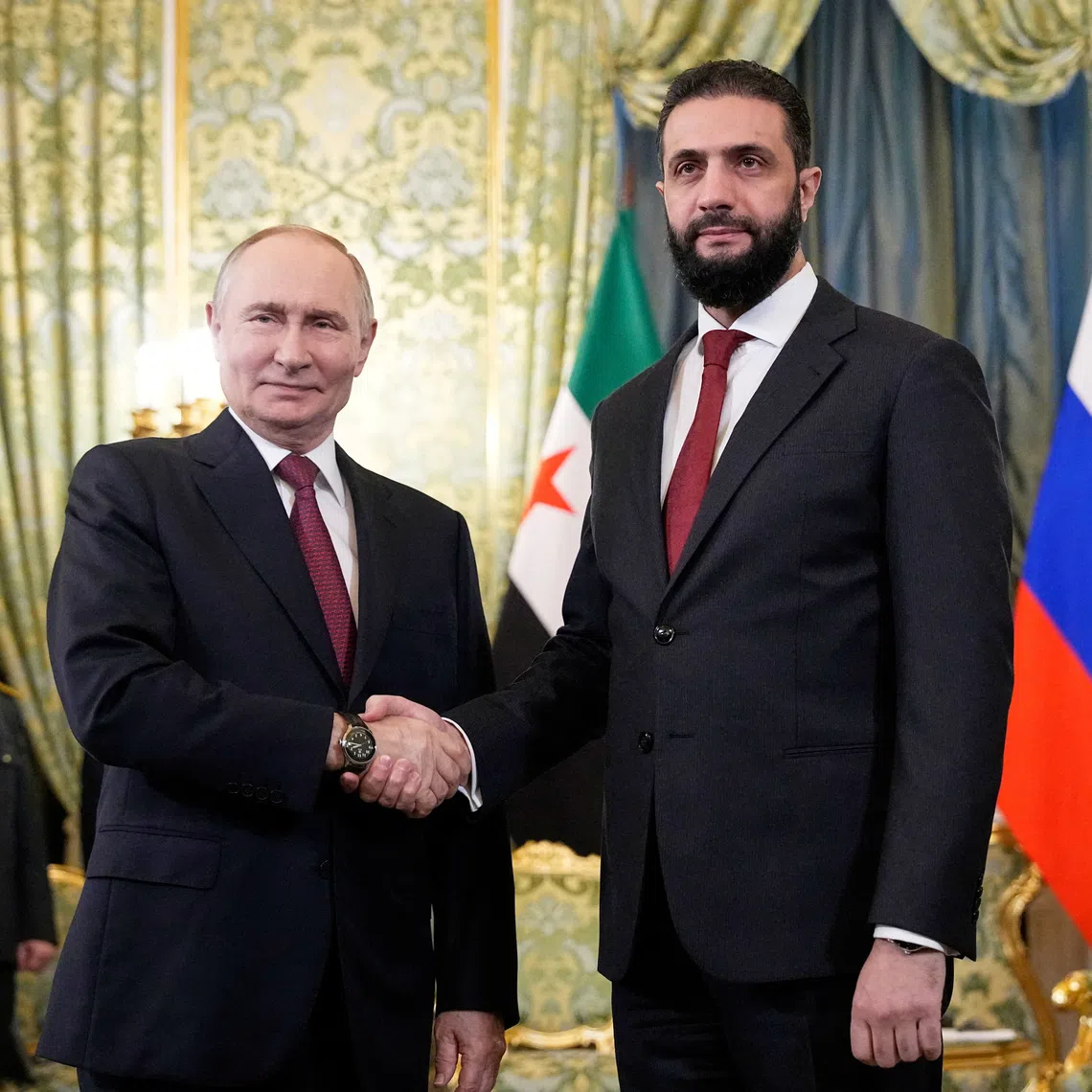 Russia's President Vladimir Putin shakes hands with Syria's President Ahmed al-Sharaa during a meeting at the Kremlin in Moscow, Russia, October 15, 2025. Alexander Zemlianichenko/Pool via REUTERS