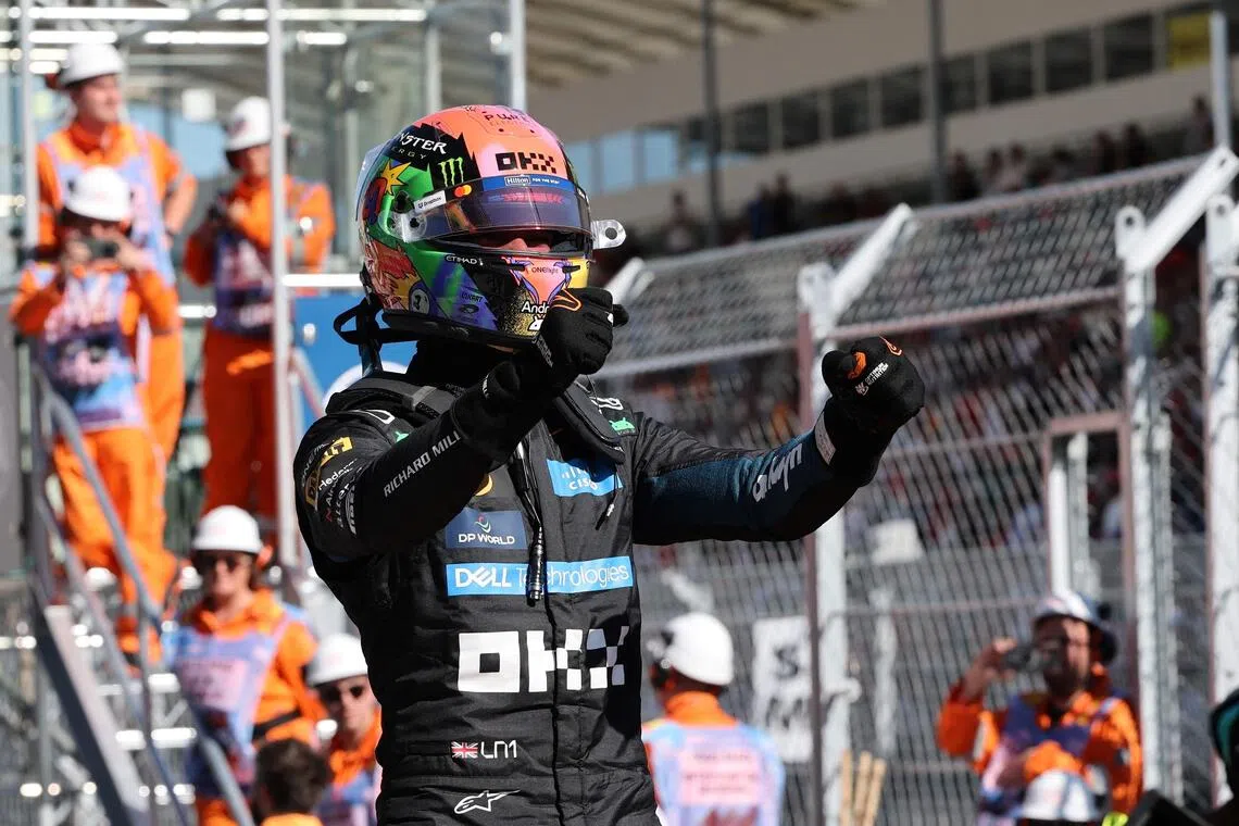 McLaren’s Lando Norris celebrates winning pole position on Sept 12, ahead of the Spanish Grand Prix.