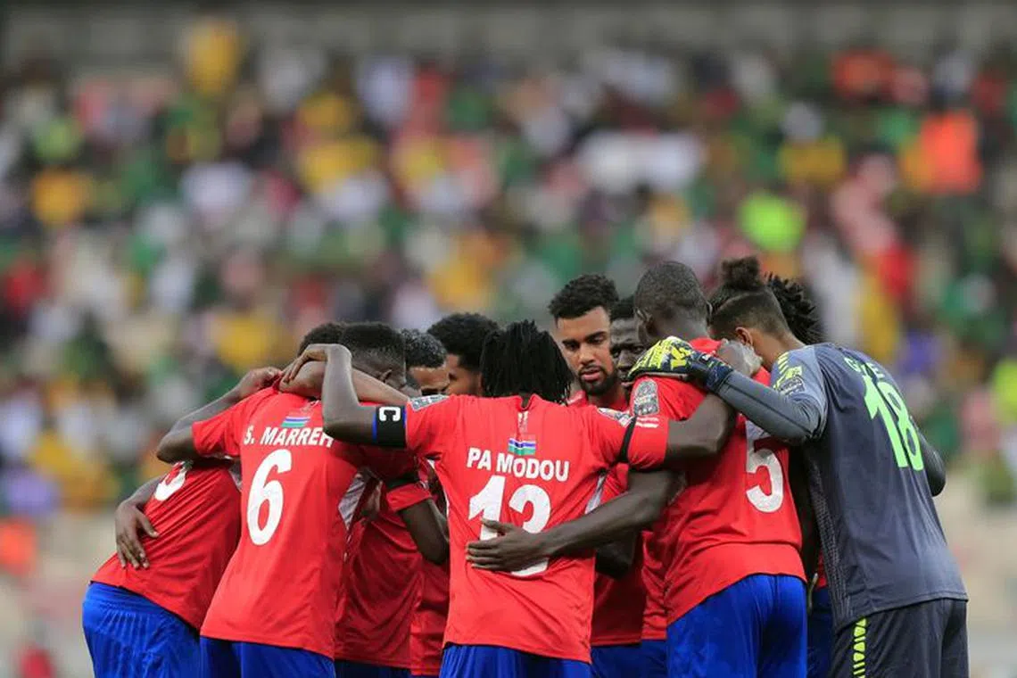Soccer Football - Africa Cup of Nations -  Quarter Final - Gambia v Cameroon - Stade de Japoma, Douala, Cameroon - January 29, 2022 Gambia players huddle before the start of the second half REUTERS/Thaier Al-Sudani/File Photo