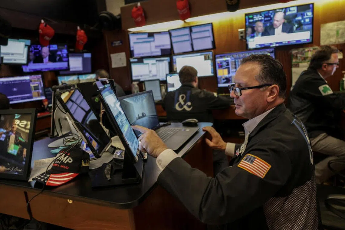 A trader works on the floor at the New York Stock Exchange (NYSE) in New York City, U.S., July 14, 2025. REUTERS/Jeenah Moon
