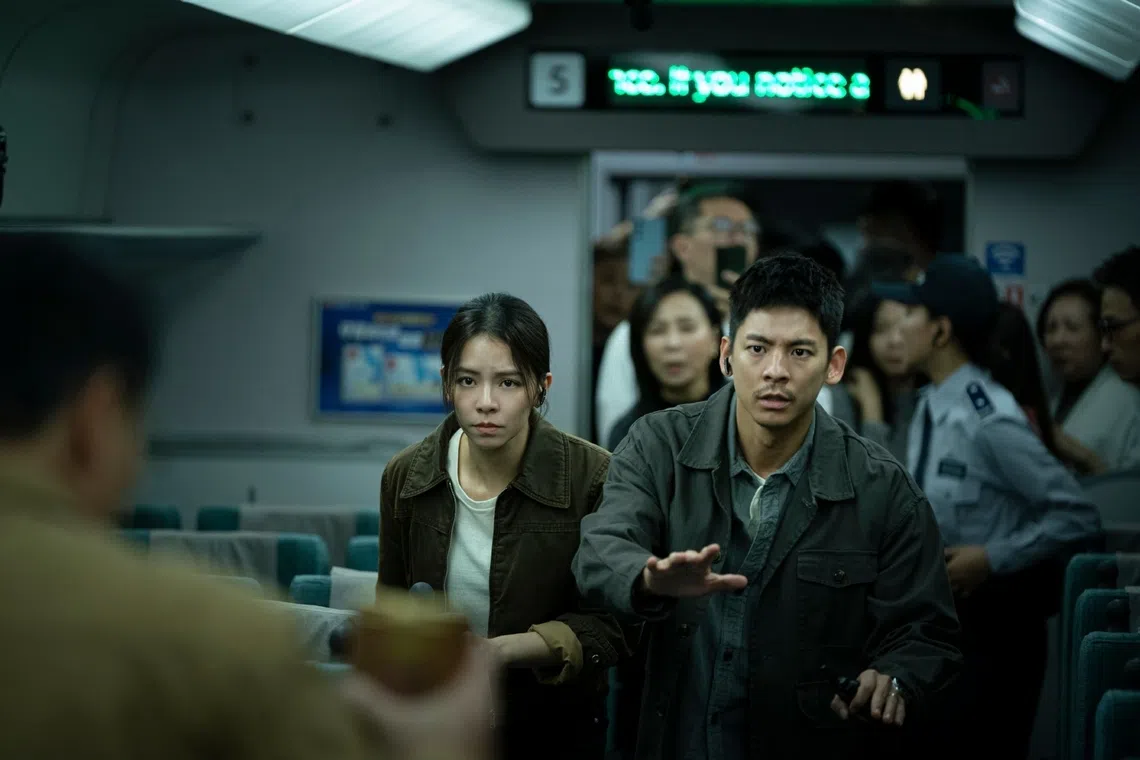 Taiwanese actors Austin Lin (foreground, right) and Vivian Sung (foreground, left) play police officers in the disaster action film 96 Minutes.