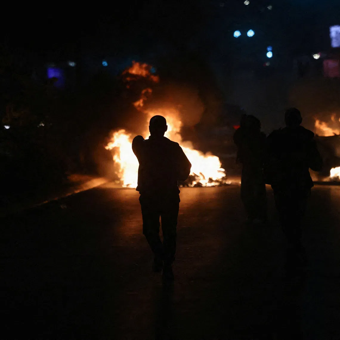 Flames rise as people protest following a Hague court verdict sentencing former Kosovo Liberation Army (KLA) leaders, including former president Hashim Thaci, to a combined 81 years in prison for war crimes, in Pristina, Kosovo, October 5, 2026. REUTERS/Valdrin Xhemaj