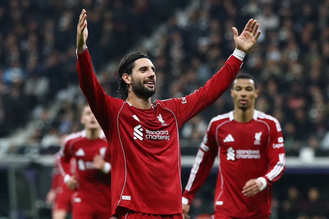 Soccer Football - UEFA Champions League - Eintracht Frankfurt v Liverpool - Deutsche Bank Park, Frankfurt, Germany - October 22, 2025  Liverpool's Dominik Szoboszlai celebrates scoring their fifth goal REUTERS/Kai Pfaffenbach