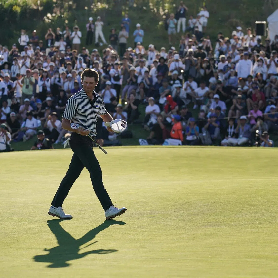 Michael Brennan on the 18th green after winning the final round of the PGA Tour Baycurrent Classic golf tournament in Yokohama on Oct 11.