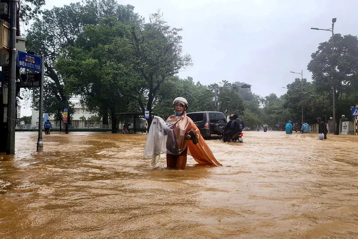 Floods kill at least 9, leave 5 missing in central Vietnam | The Straits  Times