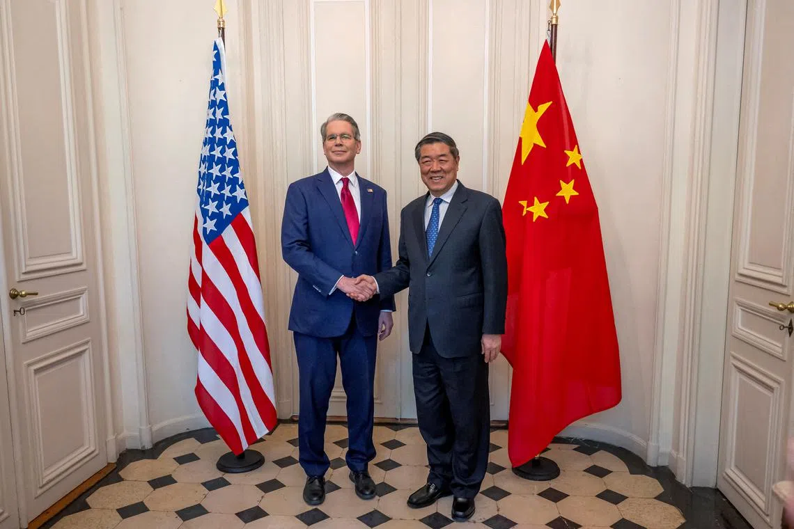 FILE PHOTO: U.S. Secretary of the Treasury Scott Bessent shakes hands with Chinese Vice Premier He Lifeng during a bilateral meeting between the U.S. and China, in Geneva, Switzerland, May 10, 2025. KEYSTONE/EDA/Martial Trezzini/Handout via REUTERS/File Photo