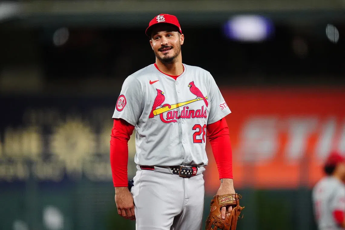 FILE PHOTO: Sep 25, 2024; Denver, Colorado, USA; St. Louis Cardinals third base Nolan Arenado (28) reacts in the third inning against the Colorado Rockies at Coors Field. Mandatory Credit: Ron Chenoy-Imagn Images/File Photo