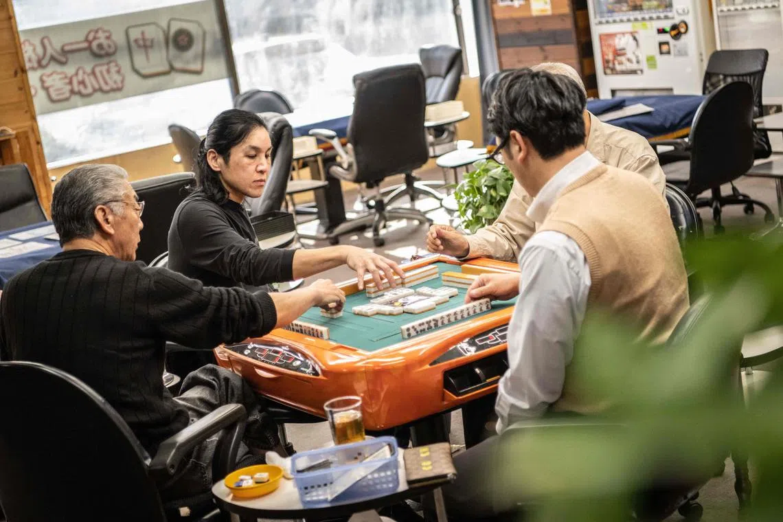 Mahjong parlour manager Yuya Motomura (second from left) plans to join the Georgian Legion to fight for Ukraine.