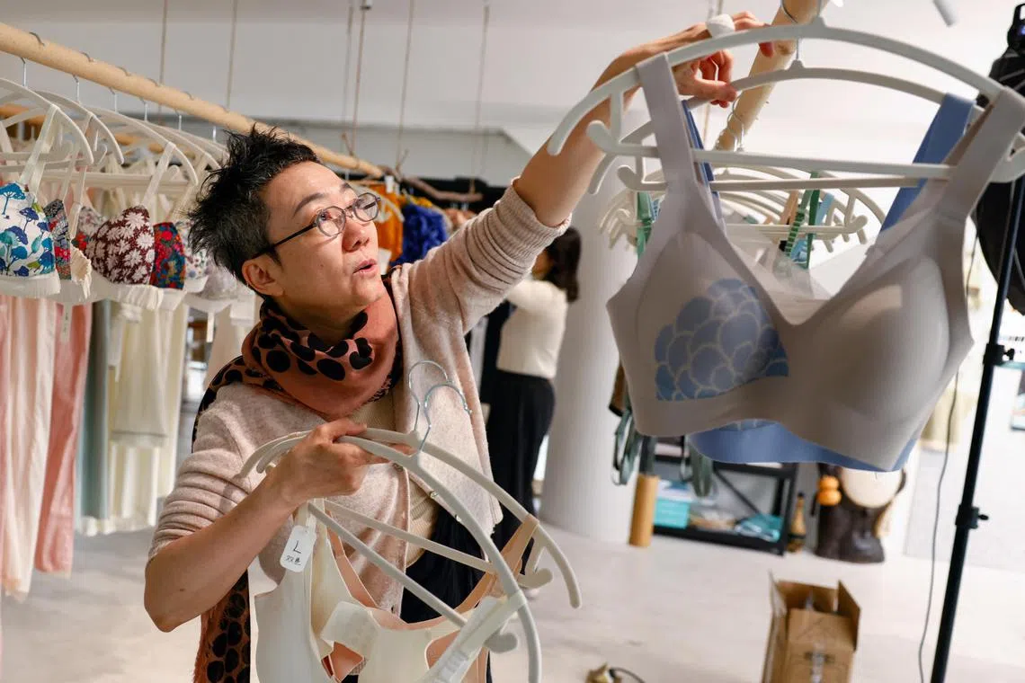Emily Yu, a designer who founded Ginger Ah, a lingerie brand for women with breast cancer, introduces her bra products at her studio in Beijing, China on March 3, 2025. 