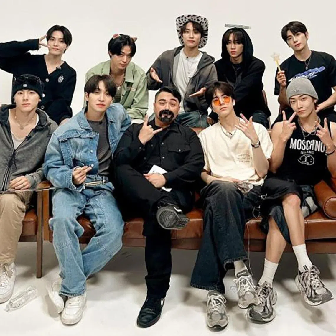 Members of The Boyz with digital creator JRE (front row, third from left).