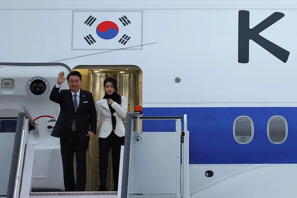 South Korean President Yoon Suk Yeol and his wife Kim Keon Hee arrive at Stansted Airport for an official state visit, near London, Britain, November 20, 2023. REUTERS/Toby Melville