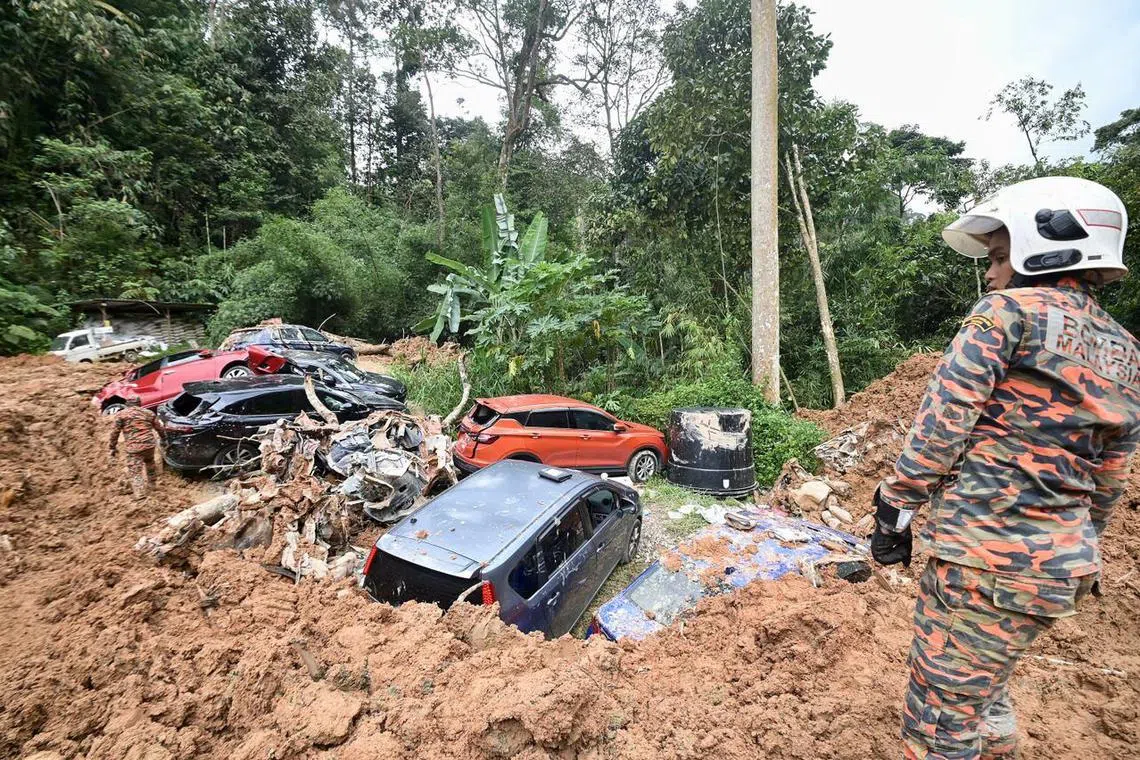 Rescuers searching for survivors at the site of the landslide in Batang Kali, Selangor, on Dec 18, 2022. 