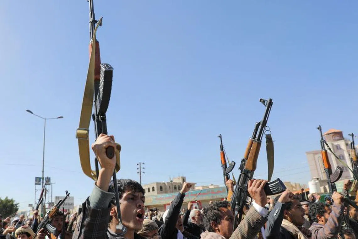FILE PHOTO: Newly recruited Houthi fighters shout slogans during a ceremony at the end of their training in Sanaa, Yemen January 11, 2024. REUTERS/Khaled Abdullah