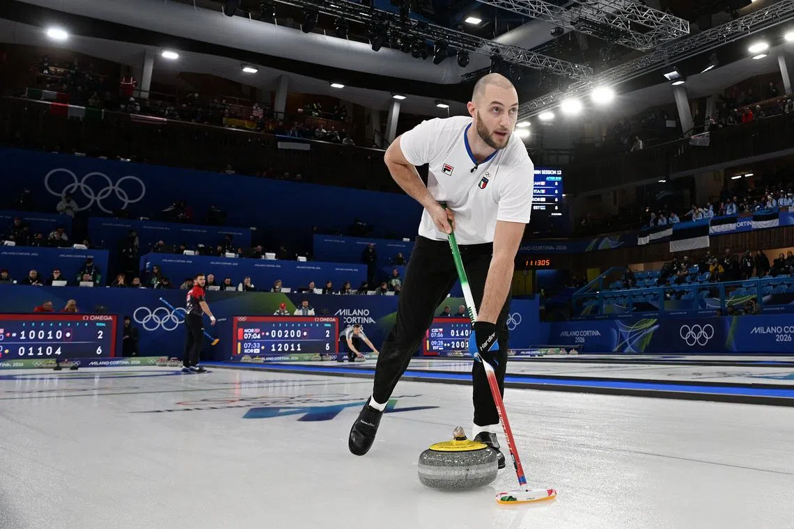 Milano Cortina 2026 Olympics - Curling - Mixed Doubles Round Robin Session 13 - United States of America vs Italy - Cortina Curling Olympic Stadium, Cortina d'Ampezzo, Italy - February 09, 2026. Amos Mosaner of Italy in action with Stefania Constantini of Italy against Korey Dropkin of United States and Cory Thiesse of United States REUTERS/Jennifer Lorenzini