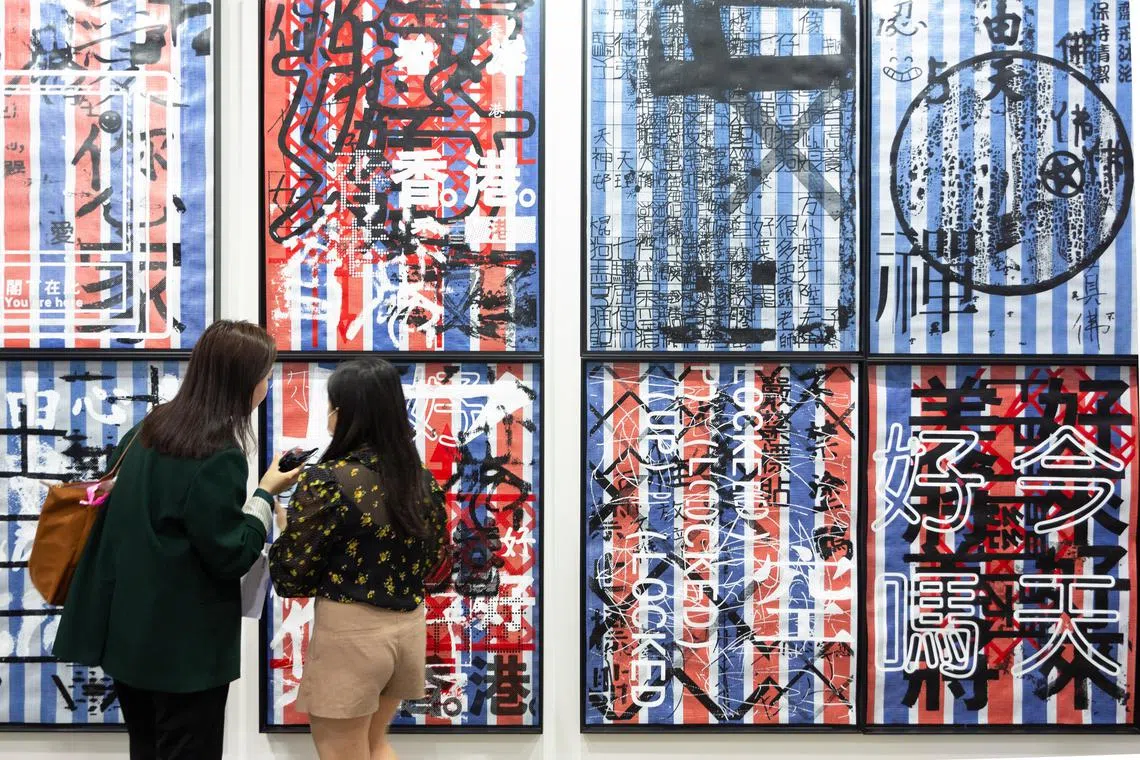 Visitors at Lucie Chang Fine Arts' booth at Art Basel Hong Kong 2023. 
