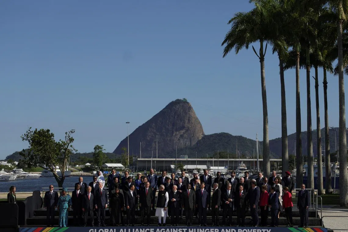 Argentina's President Javier Milei, Australia's Prime Minister Anthony Albanese, Brazil's President Luiz Inacio Lula da Silva, China's President Xi Jinping, French President Emmanuel Macron, German Chancellor Olaf Scholz, India's Prime Minister Narendra Modi, Indonesia's President Prabowo Subianto, Japan's Prime Minister Shigeru Ishiba, Mexico's President Claudia Sheinbaum, South Korea's President Yoon Suk Yeol, Russia's Foreign Minister Sergei Lavrov, Saudi Foreign Minister Prince Faisal bin Farhan Al-Saud, South Africa's President Cyril Ramaphosa, Turkish President Tayyip Erdogan, Britain's Prime Minister Keir Starmer, European Commission President Ursula von der Leyen, European Council President Charles Michel, Chair of the African Union and President of Mauritania Mohamed Ould Ghazou pose for a group photo at the G20 summit, in Rio de Janeiro, Brazil, November 18, 2024. REUTERS/Ricardo Moraes

