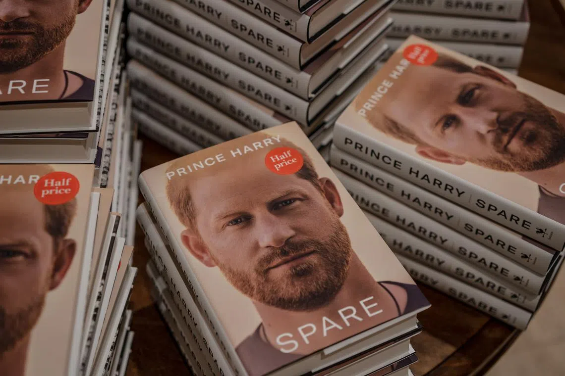 Copies of ÒSpare,Ó the new memoir by Prince Harry, at a Waterstones in London on the morning of Tuesday, Jan. 10, 2023. At once emotional and embittered, the royal memoir is mired in a paradox: drawing endless attention in an effort to renounce fame. (Andrew Testa/The New York Times)