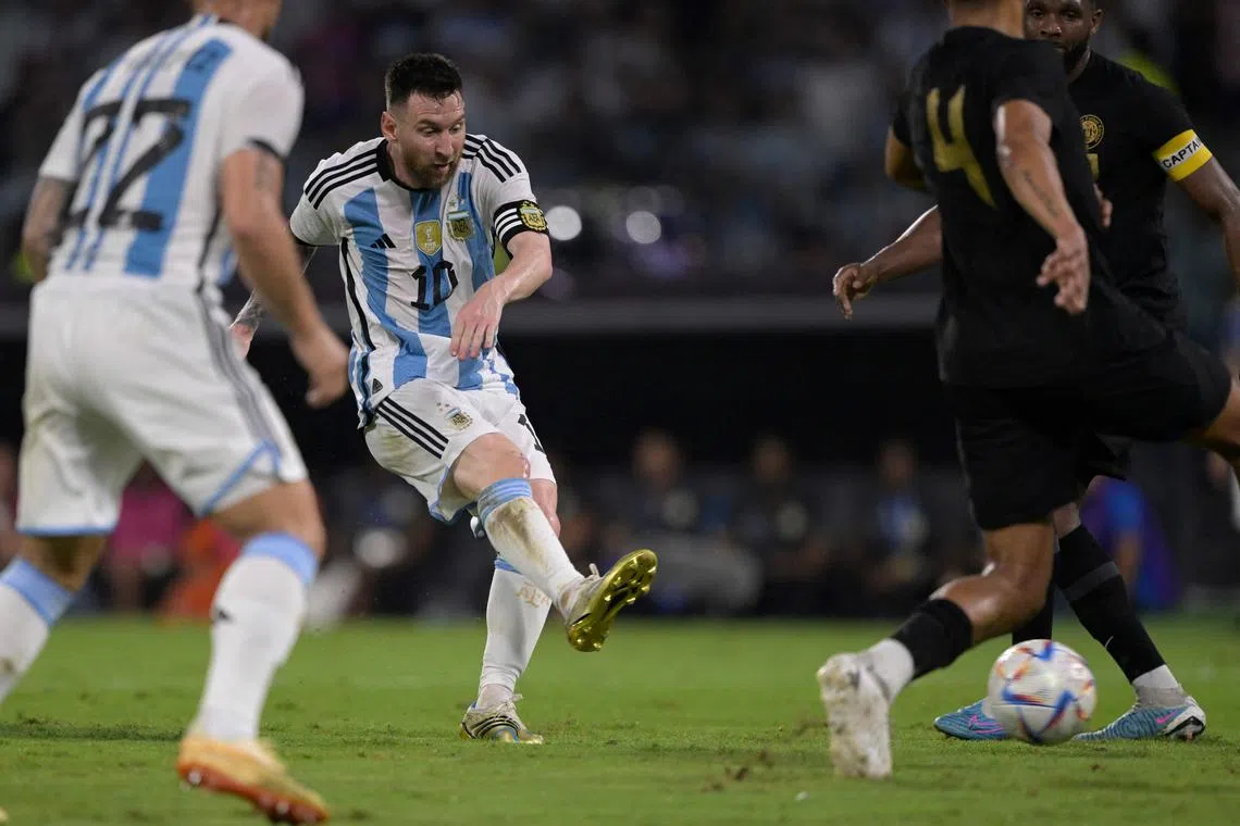 Argentina's Lionel Messi scoring his 100th goal with the national team during the friendly football match against Curacao at the Madre de Ciudades stadium in Santiago del Estero.