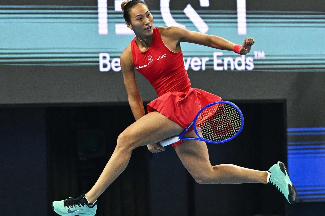 TOPSHOT - China's Zheng Qinwen hits a return to Russia's Mirra Andreeva during their women's singles final at the China Open tennis tournament in Beijing on October 11, 2026. (Photo by Pedro PARDO / AFP)
