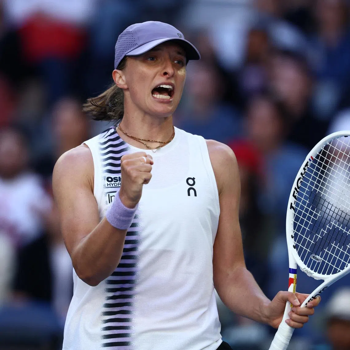 Tennis - Australian Open - Melbourne Park, Melbourne, Australia - January 22, 2026 Poland's Iga Swiatek celebrates after winning her second round match against Czech Republic's Marie Bouzkova REUTERS/Tingshu Wang