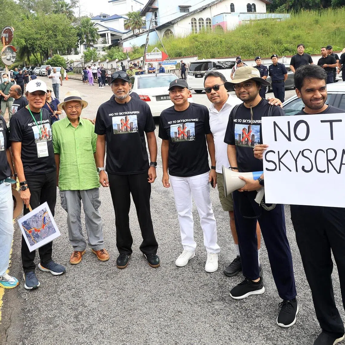 mmbukit - Former Malaysian Cabinet minister Khairy Jamaluddin (fourth from left) and ex-chief of CIMB financial group Nazir Razak (fifth from left) on Oct 4, 2025, 
 during a protest against the redevelopment of the Wisma Damansara office building into two skyscrapers, in Kuala Lumpur's elite neighbourhood of Bukit Damansara. 

Credit: THE STAR