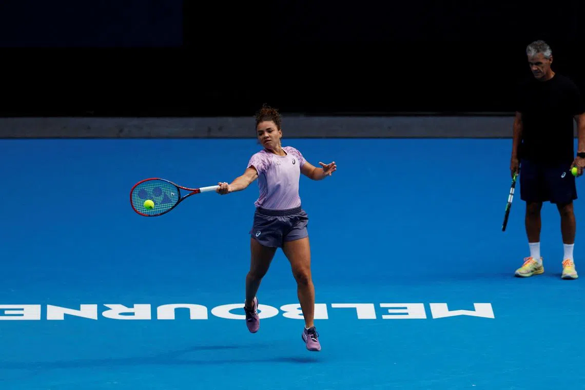FILE PHOTO: Tennis - Australian Open - Practice - Melbourne Park, Melbourne, Australia - January 10, 2025 Italy's Jasmine Paolini during a practice session ahead of the Australian Open as coach Renzo Furlan looks on REUTERS/Francis Mascarenhas/File Photo