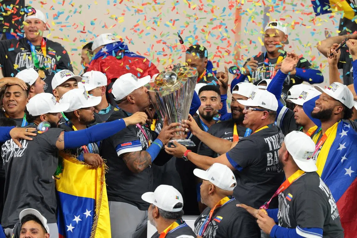 Mar 17, 2026; Miami, FL, United States; Venezuela reacts on the stage after defeating the United States during the 2026 World Baseball Classic Championship game at loanDepot Park. Mandatory Credit: Sam Navarro-Imagn Images