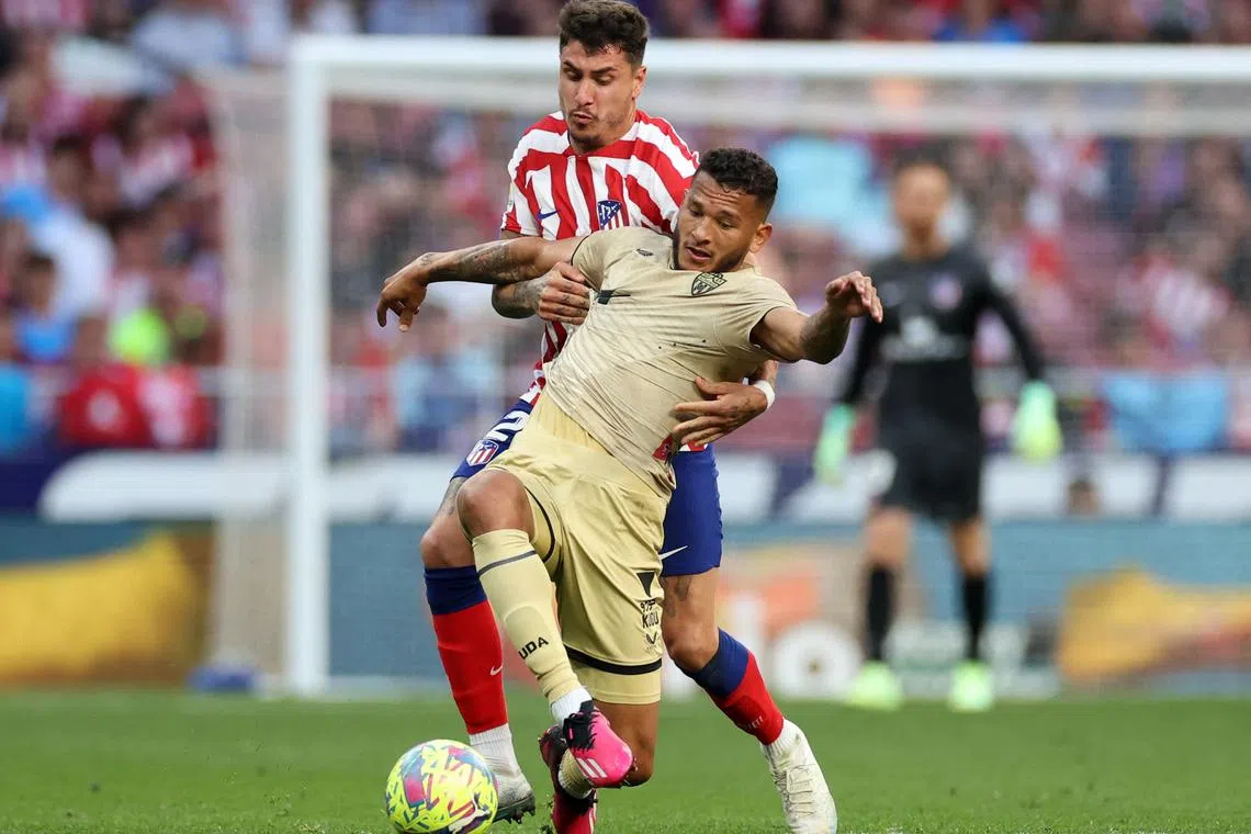 FILE PHOTO: Soccer Football - LaLiga - Atletico Madrid v Almeria - Metropolitano, Madrid, Spain - April 16, 2023 Almeria's Luis Suarez in action with Atletico Madrid's Jose Gimenez REUTERS/Isabel Infantes/File Photo