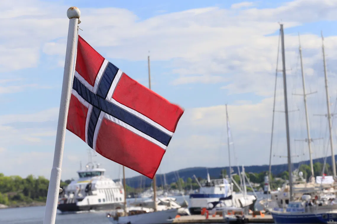 FILE PHOTO: Norwegian flag flutters on the boat at Aker Brygge in Oslo, Norway May 31, 2017. REUTERS/Ints Kalnins/ File Photo