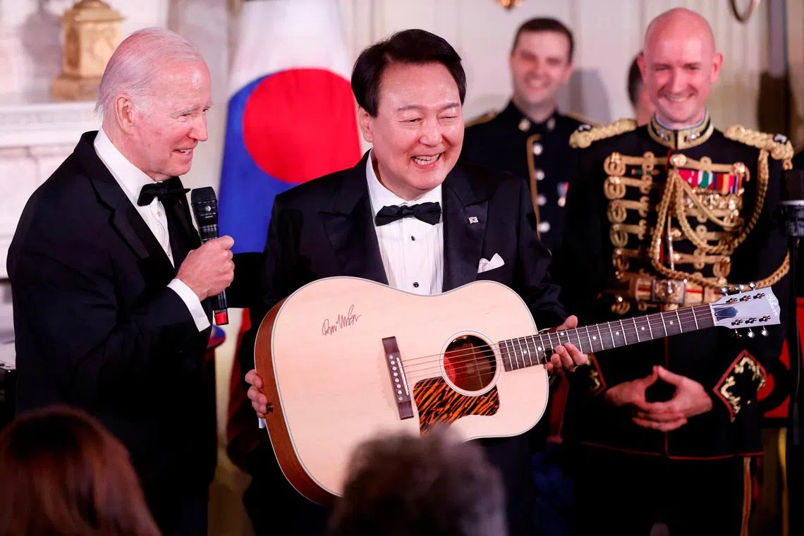 US President Joe Biden gifts South Korean President Yoon Suk-yeol a guitar signed by the American singer Don McLean.