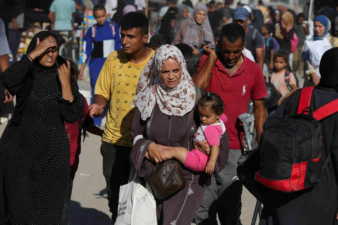 Palestinians flee the eastern part of Khan Younis following another Israeli army evacuation order.