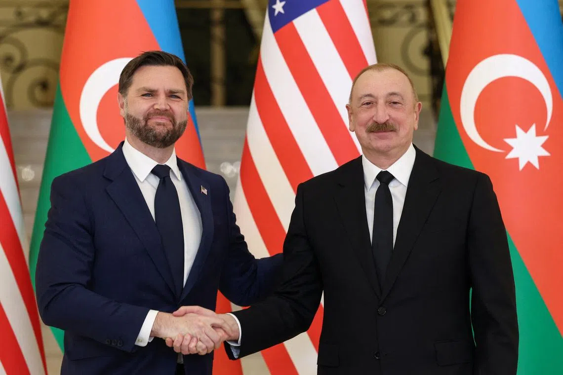 U.S. Vice President JD Vance and Azerbaijani President Ilham Aliyev shake hands, at the Zagulba Presidential Residence in Baku, Azerbaijan, February 10, 2026. REUTERS/Kevin Lamarque/Pool