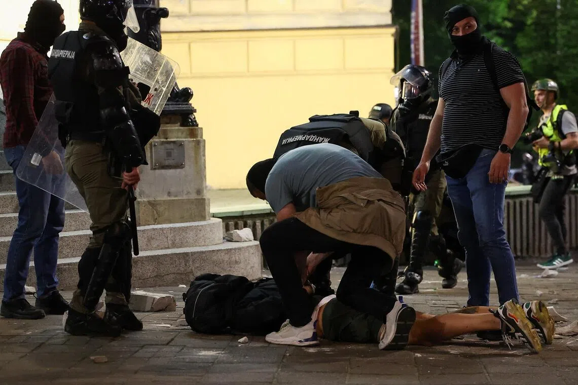 A demonstrator is handcuffed during a student-led protest demanding snap parliamentary elections, in Belgrade, Serbia, on May 23.