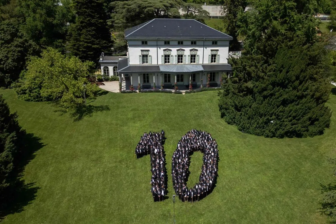 About 429 people dressed as 'The Tramp' gathering for a photograph in front of The Manoir de Ban, the final residence of English film director and actor Charlie Chaplin, during an event to celebrate the 10th anniversary of the Chaplin's World museum in Corsier-sur-Vevey, western Switzerland, on June 7, 2026. 