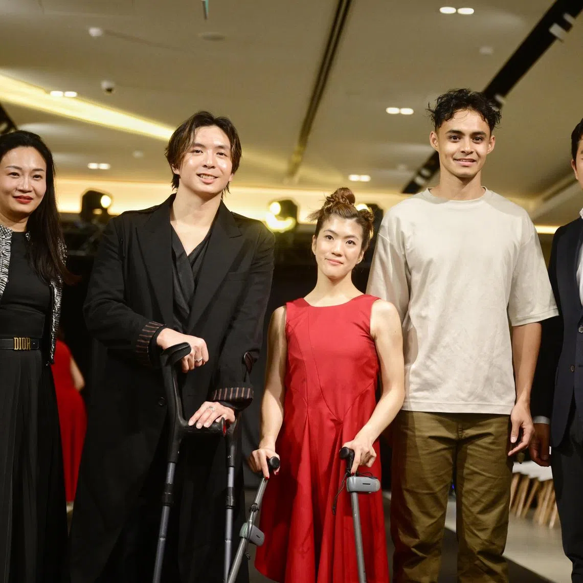 Para swimmer Toh Wei Soong (second from left) during his debut as a creative director at a fashion runway with (from left) Ms Magdelene Tan, marketing director of Inchcape Singapore, para equestrienne Gemma Foo, para long jumper Suhairi Suhani, and Mr Eric Tong, sales and distribution director of Inchcape Singapore, on Dec 12, 2024.

ST PHOTO: AZMI ATHNI
