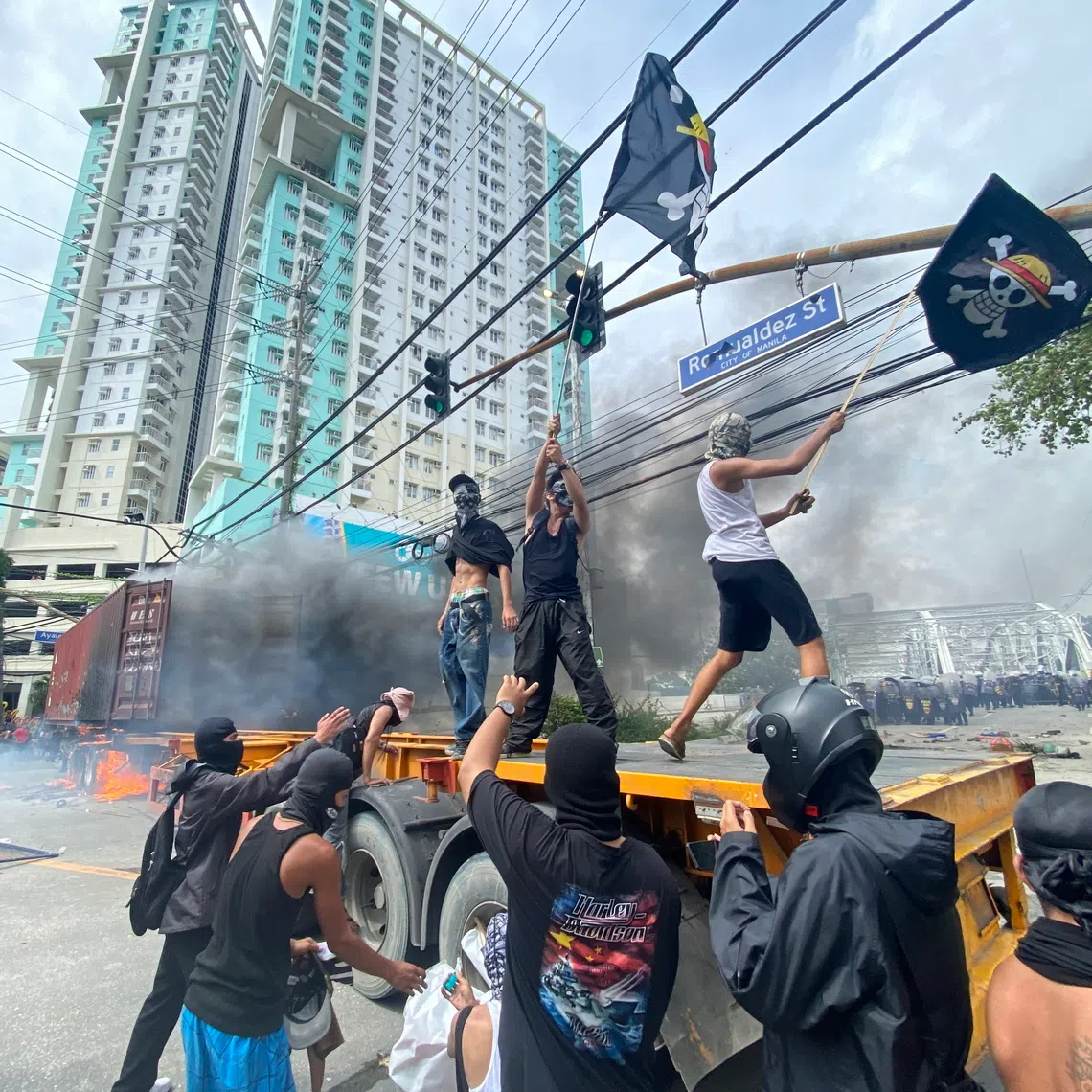 Protesters scuffle with anti-riot police during a protest rally in Manila, Philippines, on Sept 21.