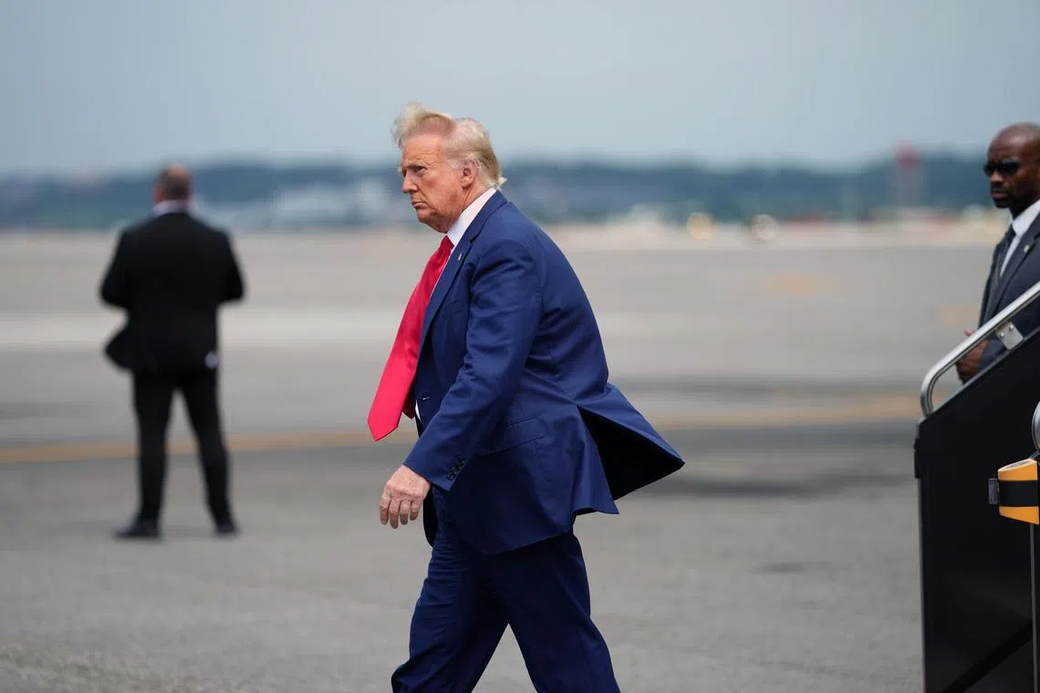 Former president Donald Trump arrives at Reagan National Airport in Washington, en route to his arraignment in federal court.