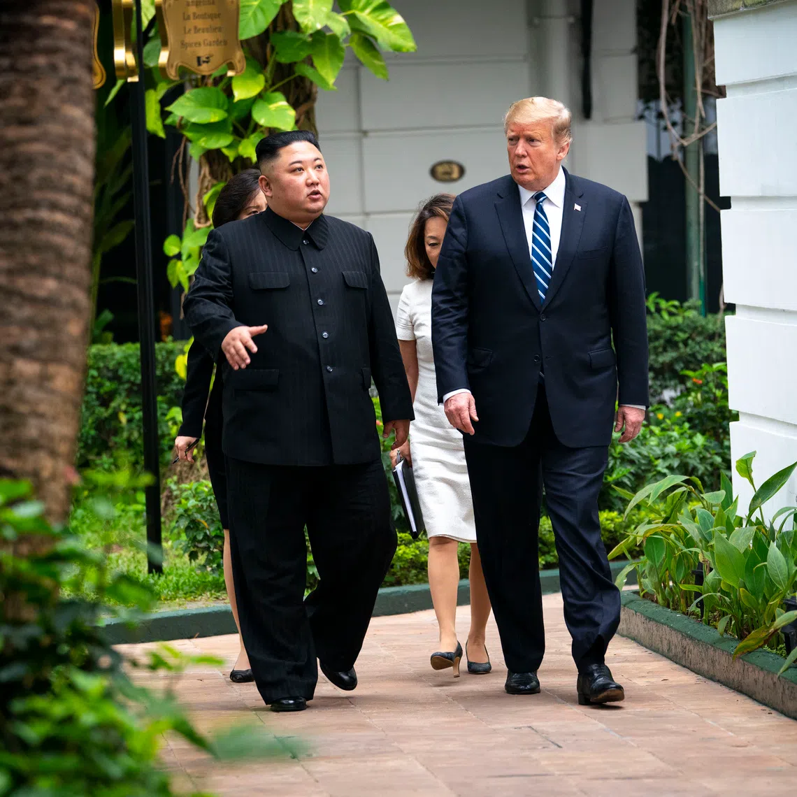 US President Donald Trump (right) walks with Kim Jong Un, the North Korean leader, as they head to a meeting in Hanoi, Vietnam, on Feb 28, 2019.