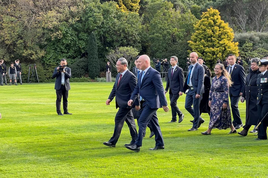New Zealand Prime Minister Christopher Luxon and Governor General Cindy Kiro welcome Chinese Premier Li Qiang with a traditional Maori welcome and honour guard, during Li Qiang's visit to New Zealand, on the grounds of the official residence of the Governor-General, in Wellington, New Zealand June 13, 2024. REUTERS/Lucy Craymer